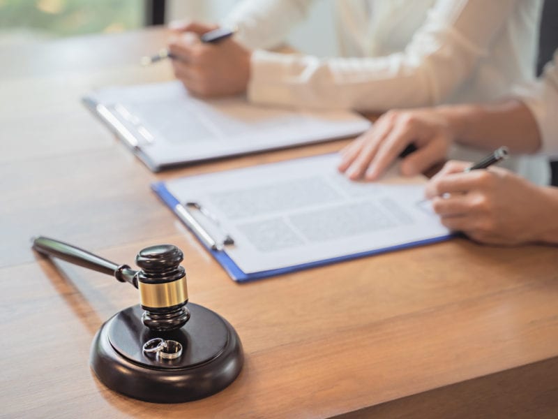 Divorce agreement. Lawyer Consultant with customer in courtroom.