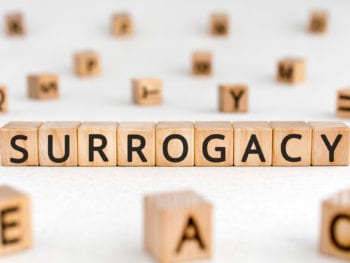 Surrogacy - word from wooden blocks with letters
