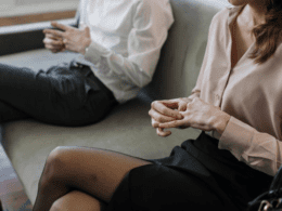 A couple removing their wedding bands after separation