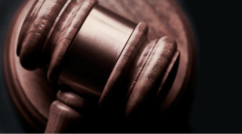  A gavel on a black background.