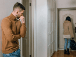 A husband watching his wife leave the house.