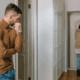 A husband watching his wife leave the house.