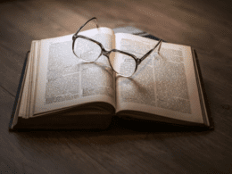 A book of law opened with a pair of glasses on top.