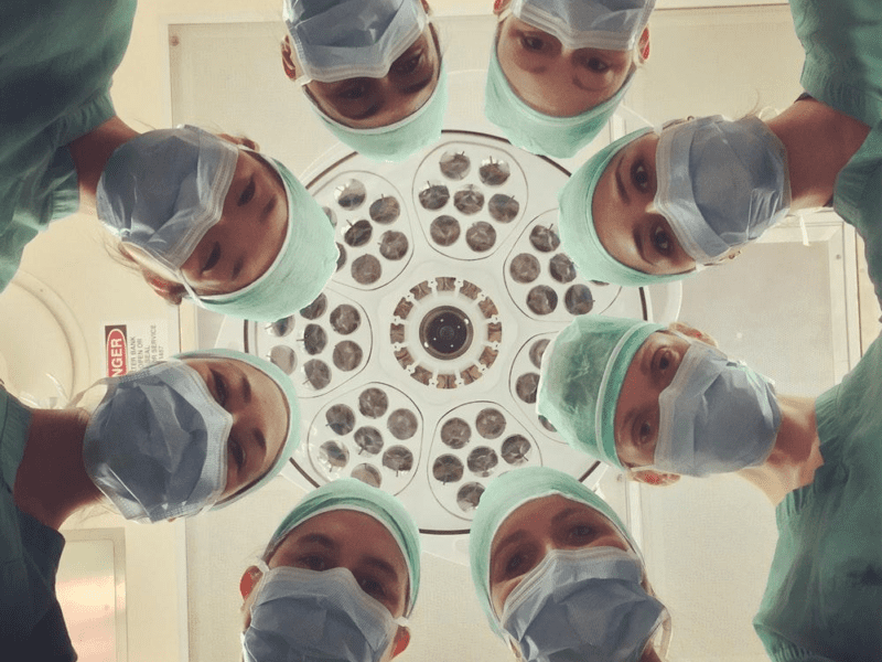 divorce - Surgeons smiling at a patient